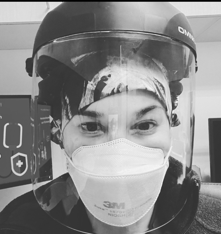 Dr. Brandy wearing medical protective equipment.