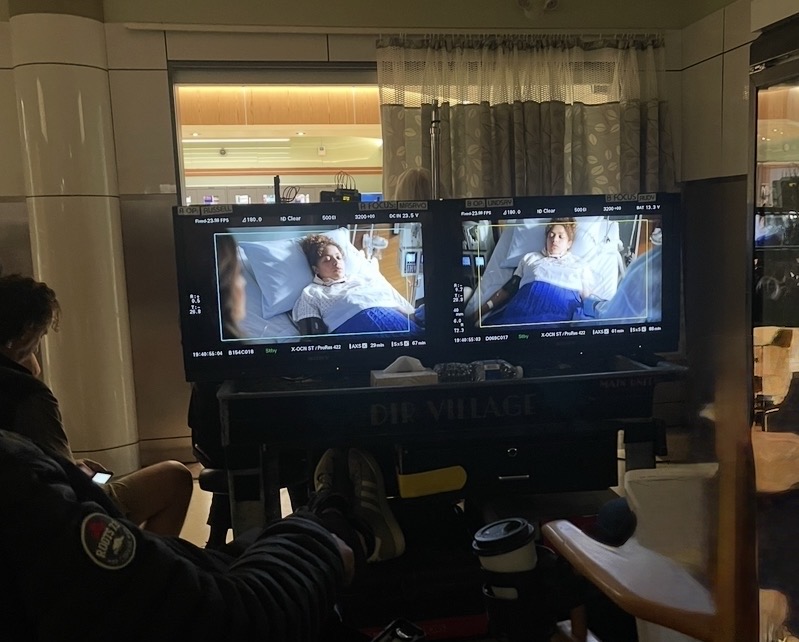 Production monitors showing two camera views of a hospital scene.