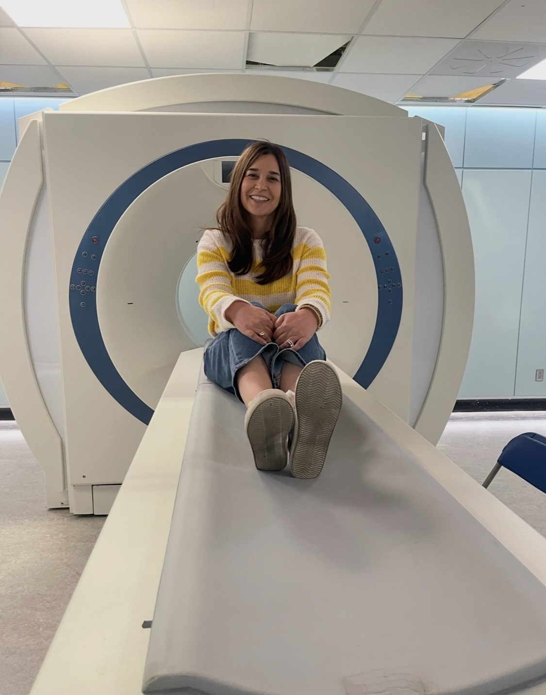 Dr. Brandy photographed with imaging equipment on a medical set.