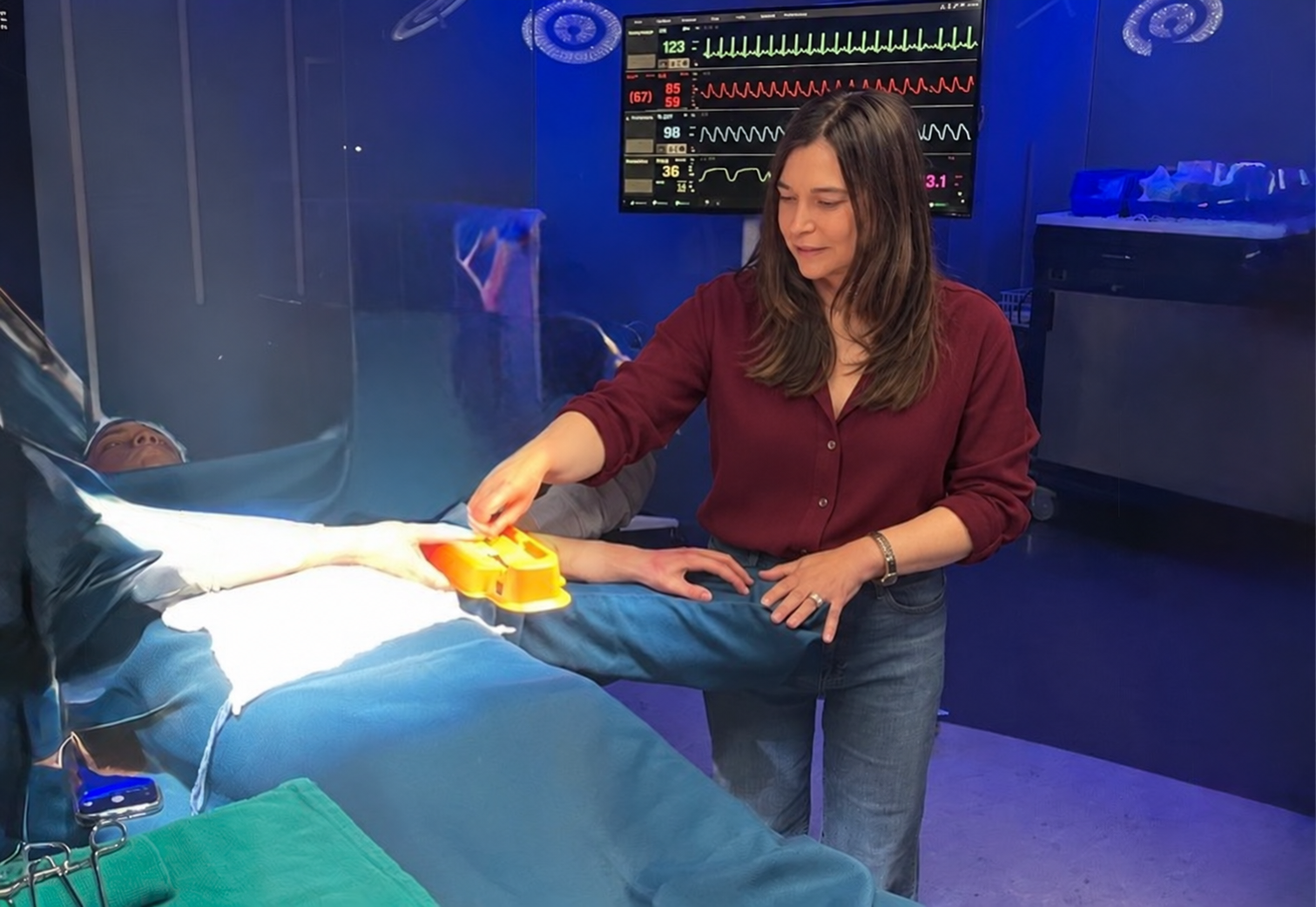 Dr. Brandy preparing the medical detail of a scene beside surgical equipment.